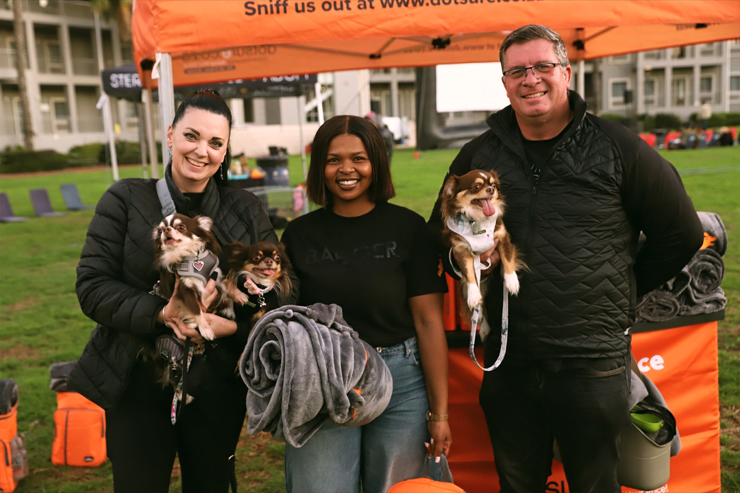 Dotsure family members, Lindi Pieterse with her husband, Mr Miyagee, Mademoiselle Lulu Belle, Alaya, and Asanda at The Galileo Open Air Cinema pet-friendly movie night in Cape Town.