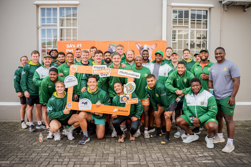 The Dotsure SWD Eagles rugby team showing their support at the Soft Landings Food Packing Day in George where they helped pack meals for those in need.